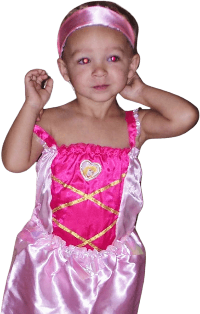 Trey as a kid, in a princess dress